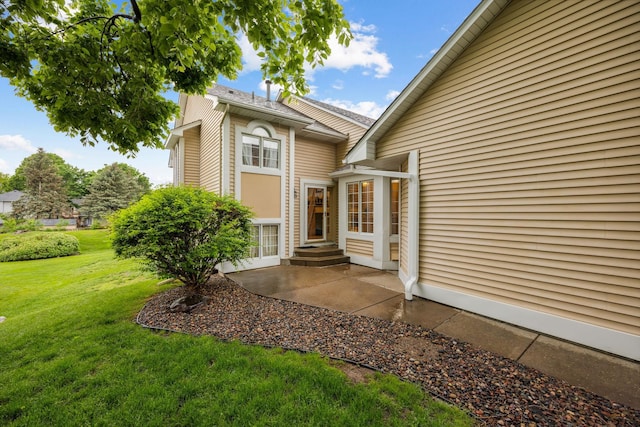 790 Winterberry Dr, Woodbury, MN 55125 - doorway to property with a lawn and a patio
