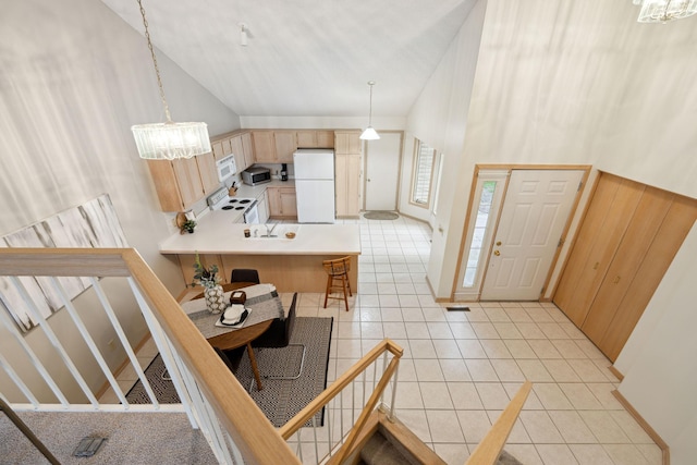 790 Winterberry Dr, Woodbury, MN 55125 - entrance foyer with light tile patterned floors, a chandelier, and high vaulted ceiling