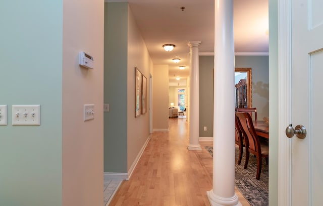 510 Grand Ave Unit 101, Saint Paul, MN 55102 - hall featuring ornate columns, light wood-style flooring, and crown molding