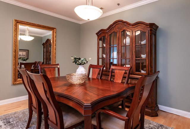 510 Grand Ave Unit 101, Saint Paul, MN 55102 - dining area featuring light wood-style flooring and crown molding
