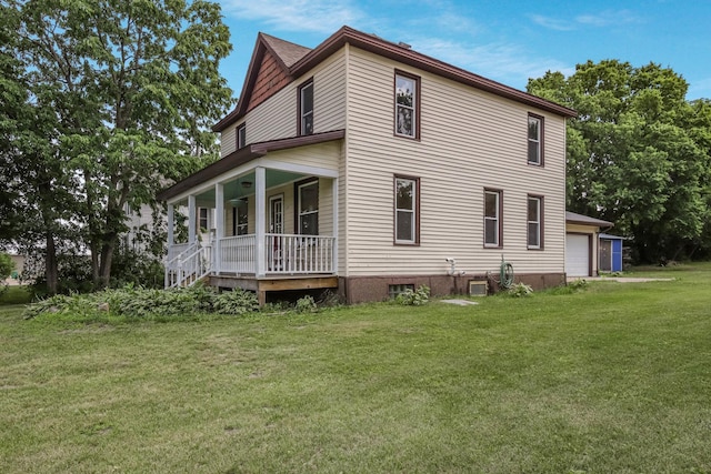 204 Main Ave, Wheeler, WI 54772 - view of property exterior featuring a porch, a yard, and a garage