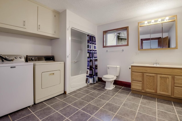 204 Main Ave, Wheeler, WI 54772 - bathroom with washer and dryer, vanity, a textured ceiling, tile patterned floors, and shower / bathtub combination with curtain