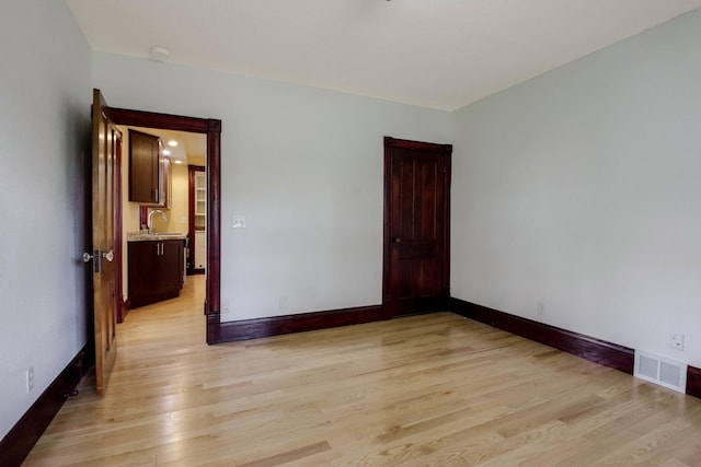 204 Main Ave, Wheeler, WI 54772 - unfurnished room with light wood-type flooring