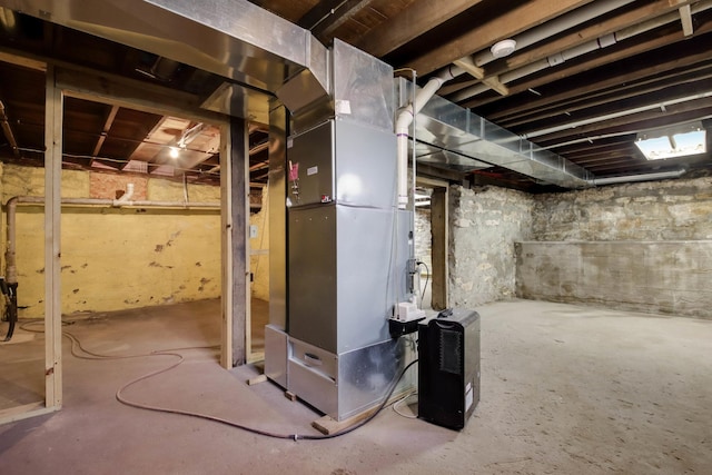 204 Main Ave, Wheeler, WI 54772 - unfinished below grade area with heating unit