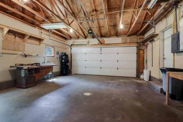 204 Main Ave, Wheeler, WI 54772 - garage featuring electric panel and a workshop area