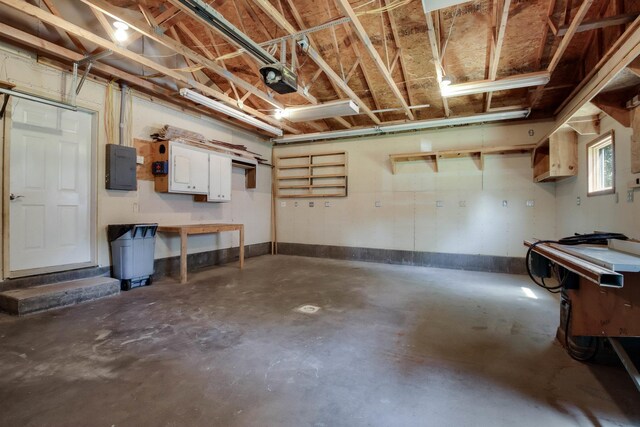 204 Main Ave, Wheeler, WI 54772 - garage featuring electric panel and a garage door opener