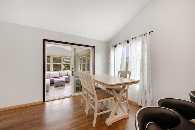 1219 Lakeview Pkwy, Buffalo, MN 55313 - dining area featuring vaulted ceiling and wood finished floors