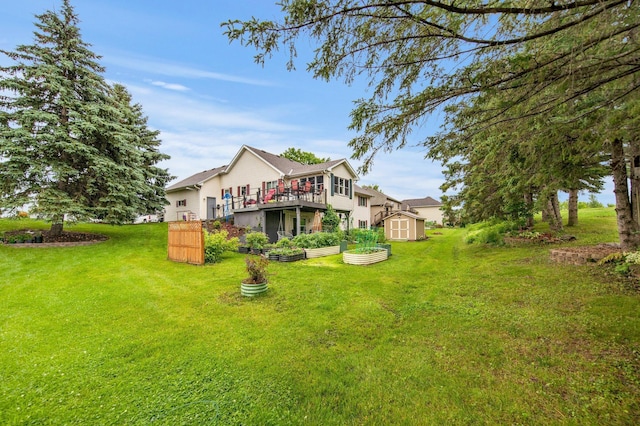 1219 Lakeview Pkwy, Buffalo, MN 55313 - view of grassy yard featuring a storage unit, a wooden deck, and a vegetable garden