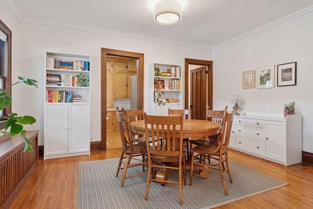 3533 Pleasant Ave Unit 3, Minneapolis, MN 55408 - dining room featuring light wood-style floors and ornamental molding