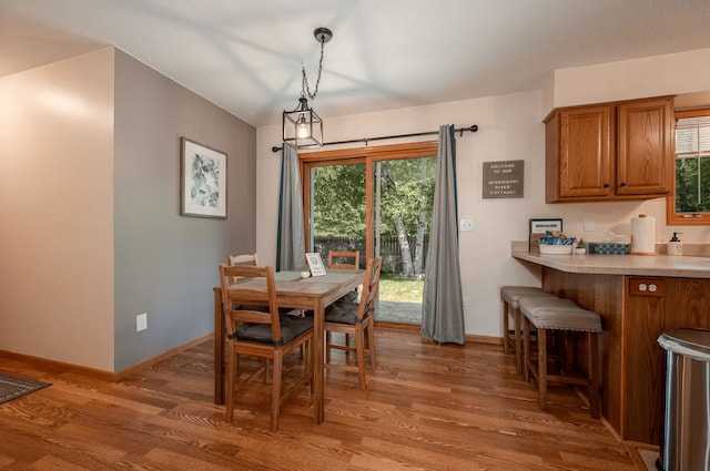 25463 County Road 267, Cohasset, MN 55721 - dining room featuring light wood-type flooring and plenty of natural light