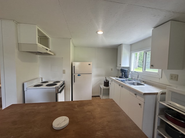 25463 County Road 267, Cohasset, MN 55721 - kitchen featuring white appliances, light countertops, white cabinets, a textured ceiling, and under cabinet range hood