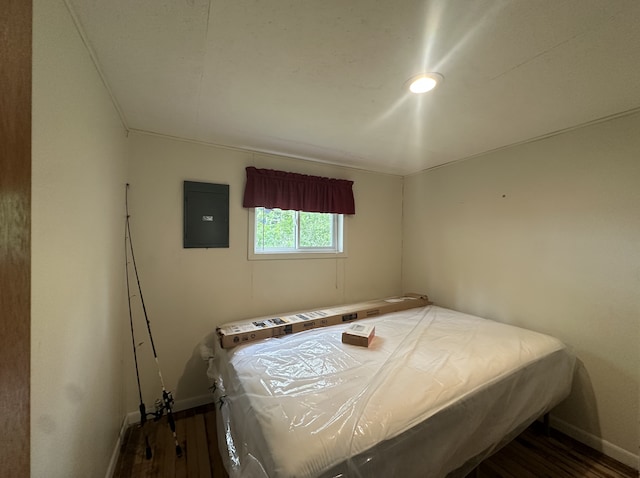 25463 County Road 267, Cohasset, MN 55721 - bedroom with electric panel and wood finished floors
