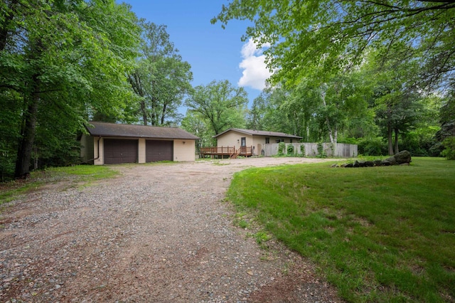 25463 County Road 267, Cohasset, MN 55721 - view of front of property with a detached garage, an outdoor structure, and a wooden deck