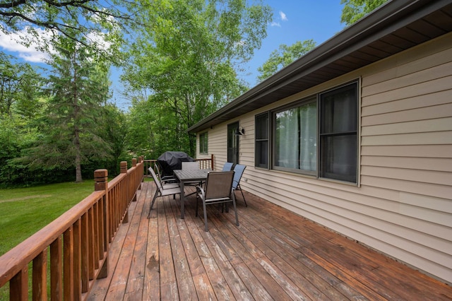 25463 County Road 267, Cohasset, MN 55721 - wooden terrace with outdoor dining space, a yard, and area for grilling