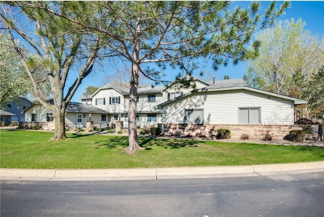 11348 Ibis St NW, Coon Rapids, MN 55433 - view of front of house featuring brick siding and a front lawn