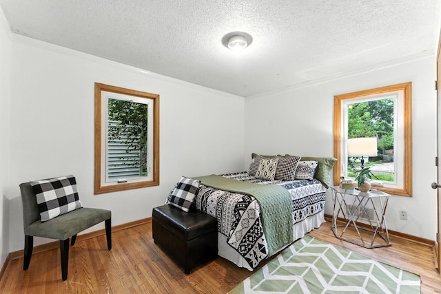 4951 Newton Ave N, Minneapolis, MN 55430 - bedroom with wood finished floors and a textured ceiling