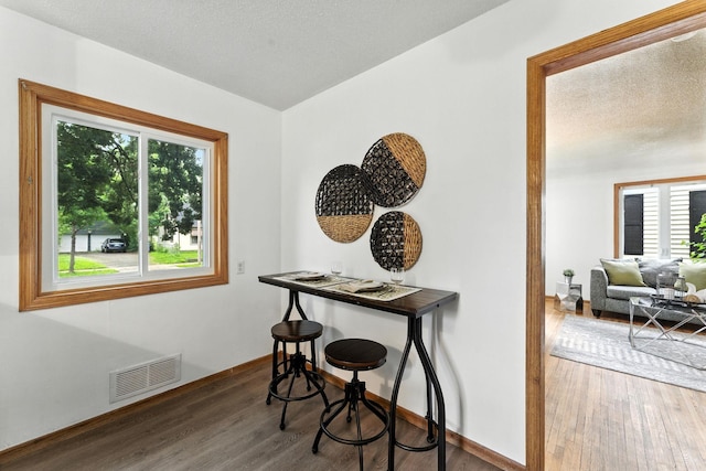 4951 Newton Ave N, Minneapolis, MN 55430 - dining room featuring wood finished floors and a textured ceiling