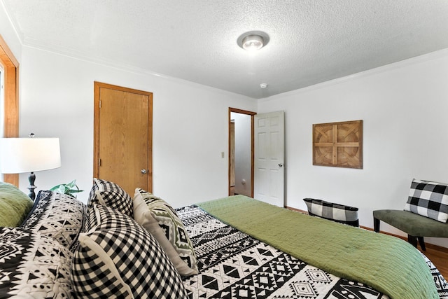 4951 Newton Ave N, Minneapolis, MN 55430 - bedroom with crown molding, a textured ceiling, and wood finished floors