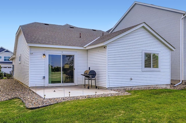 6908 101st St S, Cottage Grove, MN 55016 - back of house with a patio area, a yard, and a shingled roof