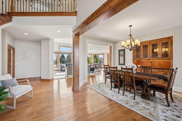 7530 Quail Ridge Trl, Greenfield, MN 55373 - dining space with a chandelier, light wood-style flooring, and recessed lighting