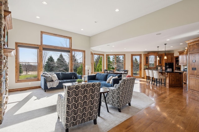 7530 Quail Ridge Trl, Greenfield, MN 55373 - living room with plenty of natural light, recessed lighting, and light wood-type flooring