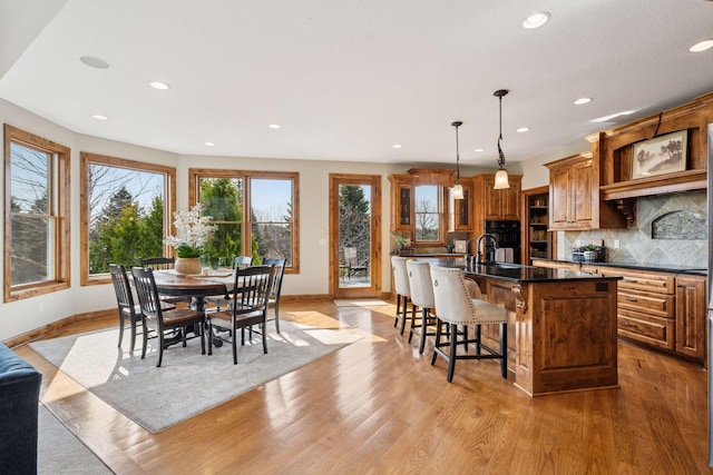 7530 Quail Ridge Trl, Greenfield, MN 55373 - dining area with light wood-style floors and recessed lighting