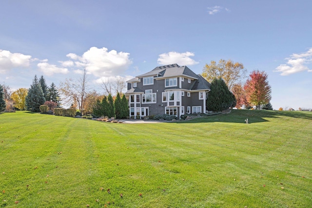 7530 Quail Ridge Trl, Greenfield, MN 55373 - back of house featuring a lawn