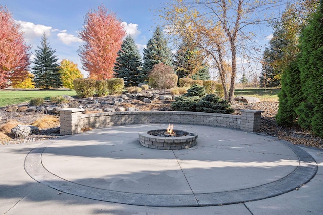 7530 Quail Ridge Trl, Greenfield, MN 55373 - view of patio featuring an outdoor fire pit