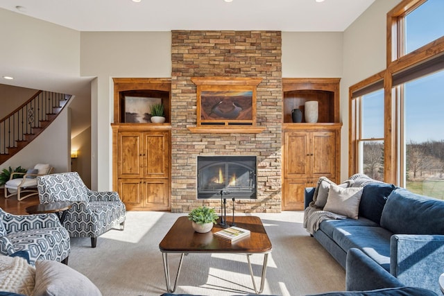 7530 Quail Ridge Trl, Greenfield, MN 55373 - living room with plenty of natural light, carpet floors, stairway, a fireplace, and recessed lighting