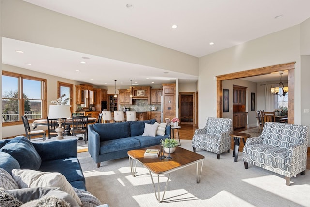 7530 Quail Ridge Trl, Greenfield, MN 55373 - living room with recessed lighting, a chandelier, and light carpet