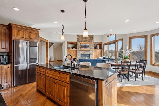 7530 Quail Ridge Trl, Greenfield, MN 55373 - kitchen with smart refrigerator, dishwasher, plenty of natural light, light wood-style flooring, and recessed lighting