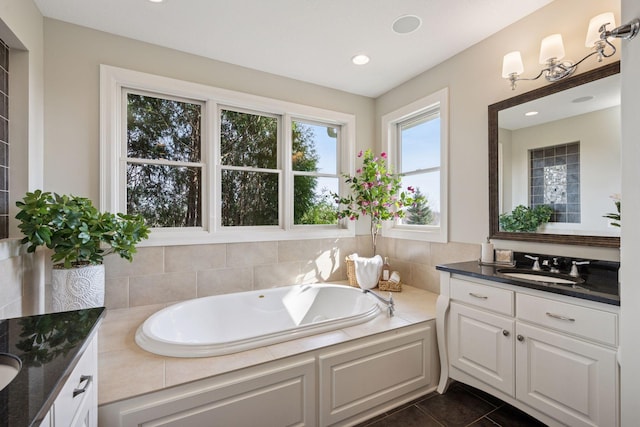 7530 Quail Ridge Trl, Greenfield, MN 55373 - full bath featuring two vanities, a garden tub, tile patterned flooring, and recessed lighting