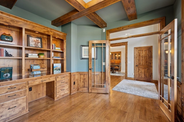 7530 Quail Ridge Trl, Greenfield, MN 55373 - unfurnished office with french doors, beam ceiling, wood finished floors, and built in desk