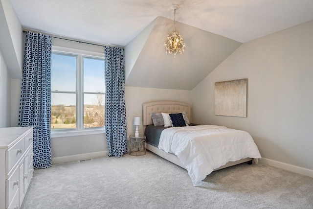 7530 Quail Ridge Trl, Greenfield, MN 55373 - bedroom featuring multiple windows, vaulted ceiling, light carpet, and a chandelier