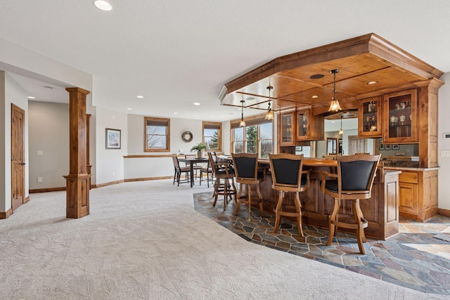 7530 Quail Ridge Trl, Greenfield, MN 55373 - bar area featuring light carpet, ornate columns, recessed lighting, and pendant lighting