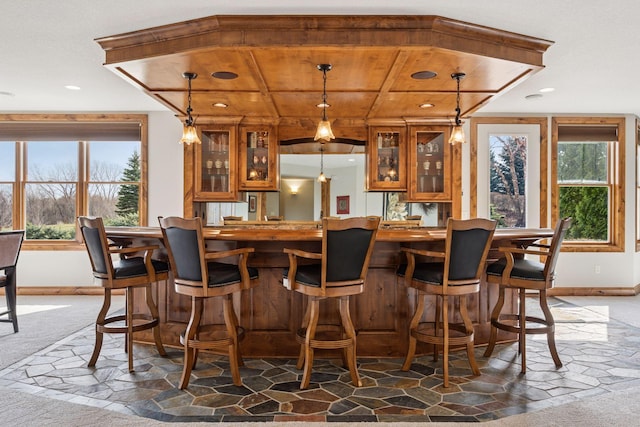 7530 Quail Ridge Trl, Greenfield, MN 55373 - indoor wet bar featuring pendant lighting, recessed lighting, wood ceiling, dark stone finish flooring, and dark colored carpet