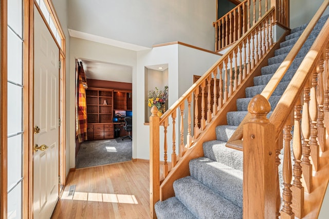 14916 Overlook Dr, Savage, MN 55378 - entrance foyer featuring wood finished floors, stairway, and a high ceiling