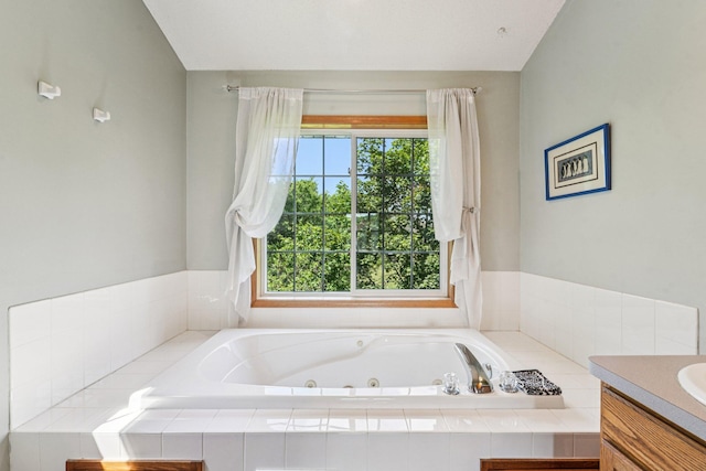 14916 Overlook Dr, Savage, MN 55378 - bathroom with healthy amount of natural light, a jetted tub, and vanity