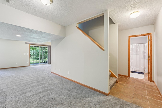 14916 Overlook Dr, Savage, MN 55378 - below grade area with a textured ceiling, stairs, and light colored carpet