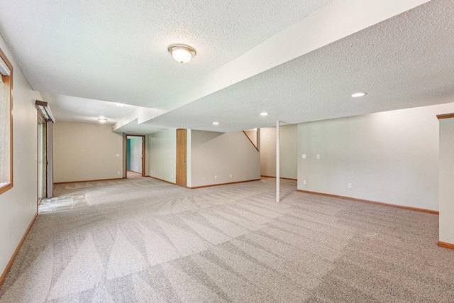 14916 Overlook Dr, Savage, MN 55378 - finished basement with a textured ceiling, light colored carpet, and recessed lighting