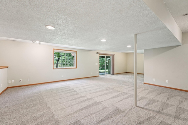 14916 Overlook Dr, Savage, MN 55378 - below grade area with light colored carpet, a textured ceiling, and recessed lighting
