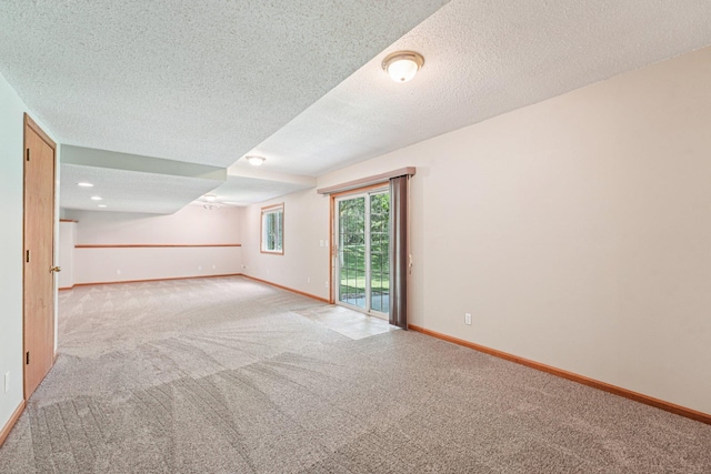 14916 Overlook Dr, Savage, MN 55378 - spare room featuring carpet floors and a textured ceiling