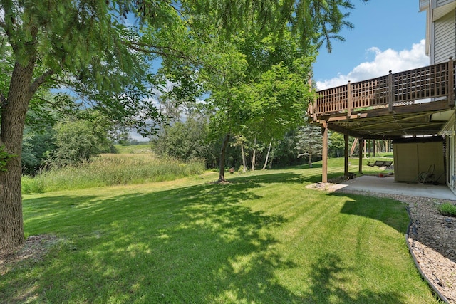 14916 Overlook Dr, Savage, MN 55378 - view of grassy yard featuring a patio and a wooden deck