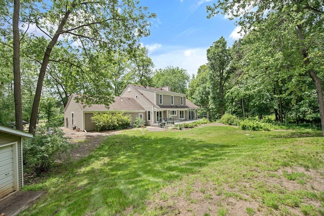 2261 Ash St, Lino Lakes, MN 55110 - rear view of property featuring a yard and a chimney