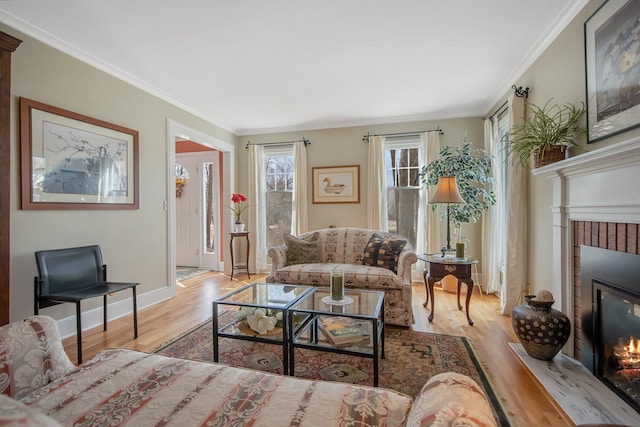 2261 Ash St, Lino Lakes, MN 55110 - living room with a brick fireplace, wood finished floors, and ornamental molding