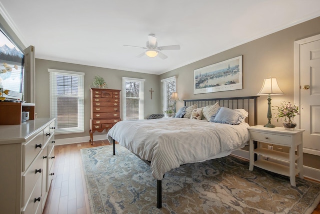 2261 Ash St, Lino Lakes, MN 55110 - bedroom featuring wood finished floors, crown molding, and ceiling fan