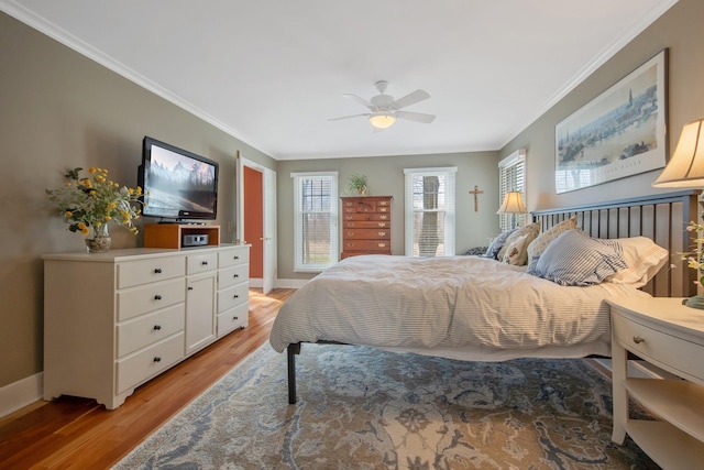 2261 Ash St, Lino Lakes, MN 55110 - bedroom with light wood-type flooring, crown molding, and a ceiling fan