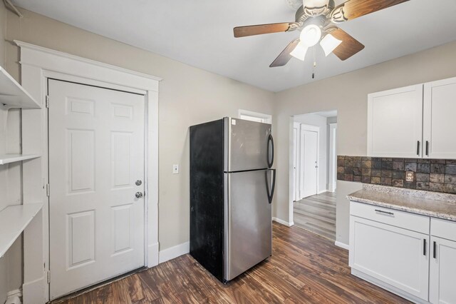 61 Delos St W, Saint Paul, MN 55107 - kitchen with freestanding refrigerator, dark wood-style floors, backsplash, a ceiling fan, and white cabinetry