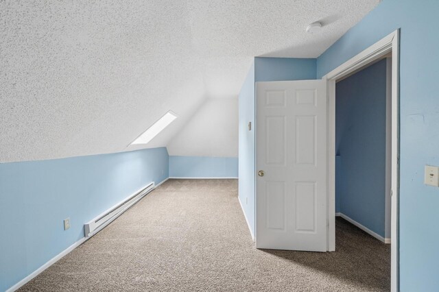 61 Delos St W, Saint Paul, MN 55107 - additional living space featuring a baseboard heating unit, carpet floors, a textured ceiling, a skylight, and vaulted ceiling