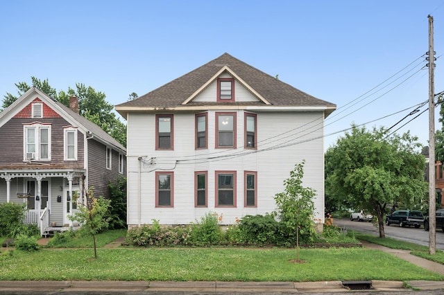 61 Delos St W, Saint Paul, MN 55107 - victorian house featuring a front yard